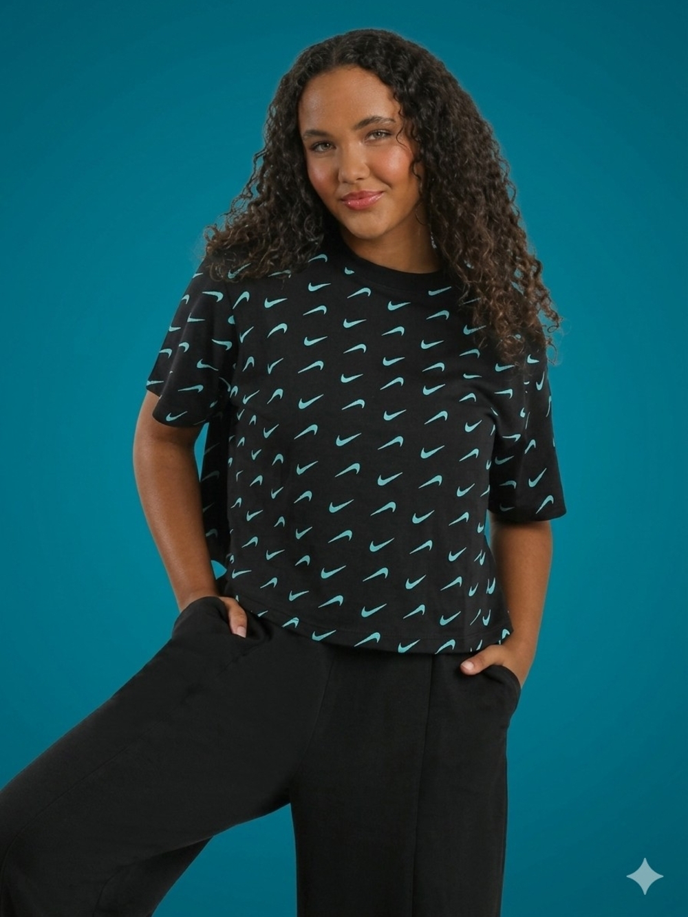 Nike Black Short-Sleeve Crop Tee with Teal Swoosh Pattern - Women